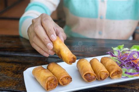 Girl Eating Spring Rolls By Using Hand Stock Photo Image Of