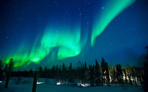 The Northern Lights Across The Sky With Greens And Blues Stock Photo