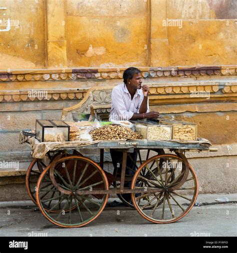 An Indian Vendor On The Street Selling Food On A Cart Jaisalmer