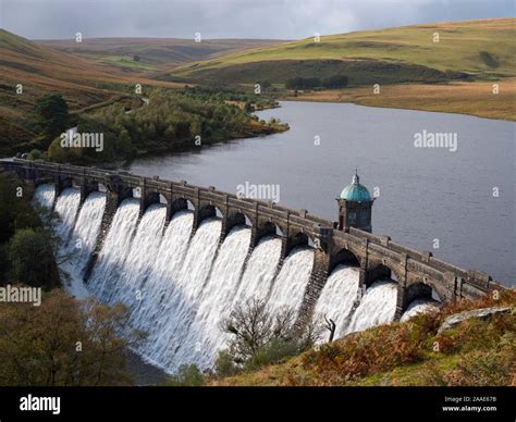 Craig Goch Dam Overflowing And Reservoir Elan Valley Wales Uk Stock