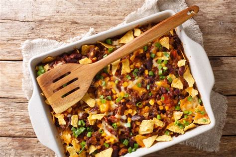 Mexican Frito Pie With Ground Beef Cheese Vegetables And Chips Close