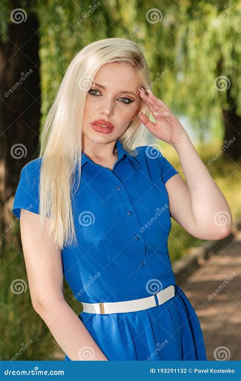 Portrait Of A Beautiful Blonde Girl Outdoors In Summer Stock Photo