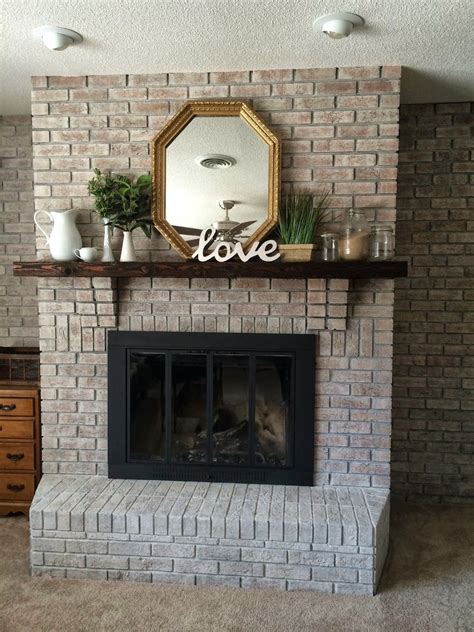 Notice what colors exist on your exterior that cannot be changed—the dark gray flecks in your brick, for she whitewashed brick, paint the wood shelving and mantel and spray painted the brass fireplace surround all in 24 hours. Inspiration photos for a fireplace with a grey paint wash ...