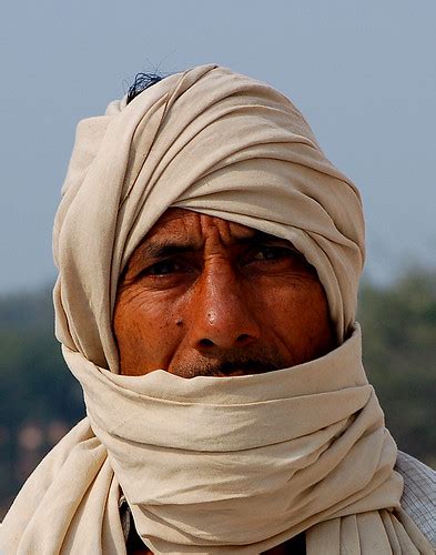 A Man Covering His Mouth With Head Scarf Yetty Yustiati