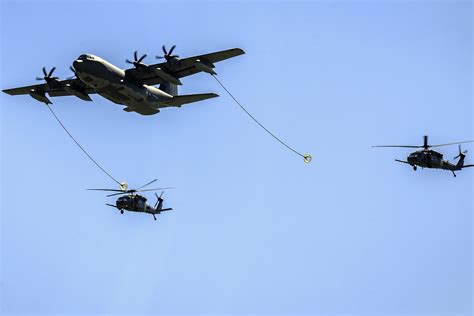 Two Hh 60 Pave Hawks Refueling From A Hc 130j Combat King During
