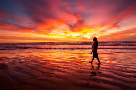 Woman Walking Alone On The Beach In The Sunset Stock Image Image Of Coast Dress