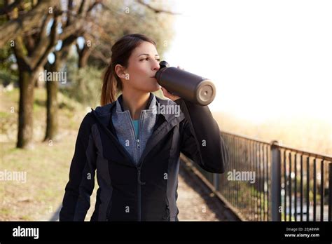 Fitness Woman Drinking Water From A Bottle After Workout Stock Photo
