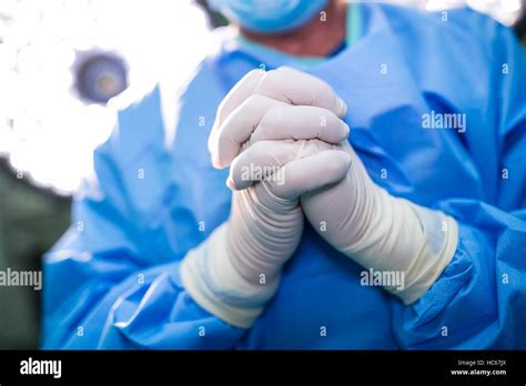 Surgeon Praying In Operation Room While Operation Stock Photo Alamy