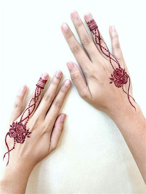 You can ink henna tattoos on your hands, arms, chest, back and 1. Simple rose 😍 | Cute henna, Hand henna, Hand tattoos