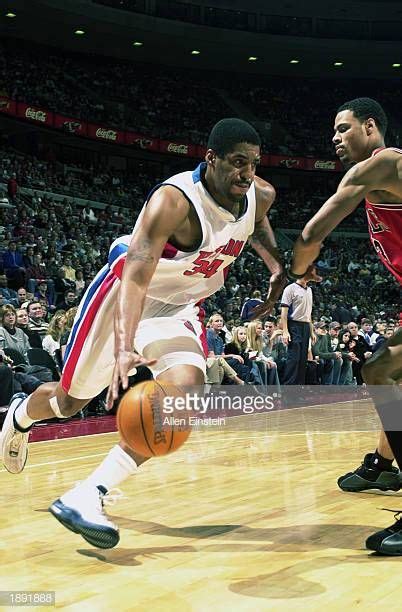 Corliss Williamson Of The Detroit Pistons Drives Against The Chicago