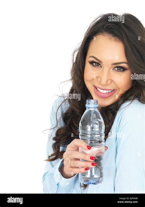 Attractive Young Woman Holding A Bottle Of Mineral Water Stock Photo