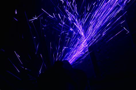 Magic Glowing Flow Of Sparks In The Dark Background Stock Photo