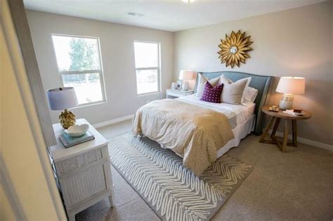 !function neutral master bedroom design with a white, beige, and gray color scheme featuring a woven seat wood bench at the foot of the bed and a large. Henry Walker Homes - girl's rooms - cafe au lait walls ...