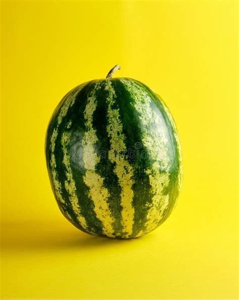 Green Striped Whole Round Watermelon And A Piece With Red Pulp And