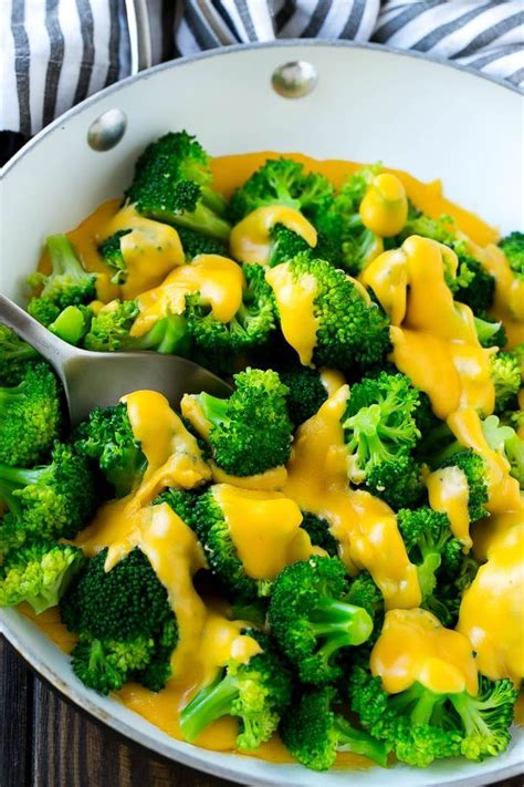 A Pan Of Broccoli With Cheese Sauce Thats Full Of Steamed Broccoli