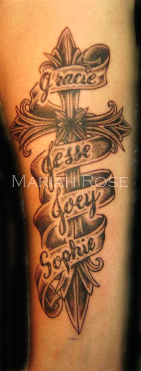 Cross tattoo on the wrist is always black in color as the size of the tattoo is small and there is no space to add colors. Cross with Names in Banner by mars-ink on DeviantArt