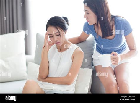 Young Chinese Woman Comforting Her Friend Stock Photo Alamy