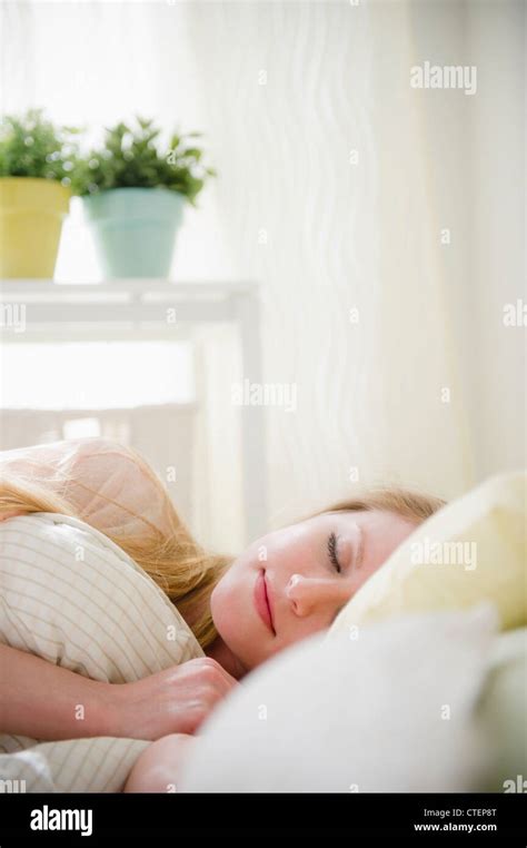 USA New Jersey Jersey City Woman Sleeping In Bed Stock Photo Alamy