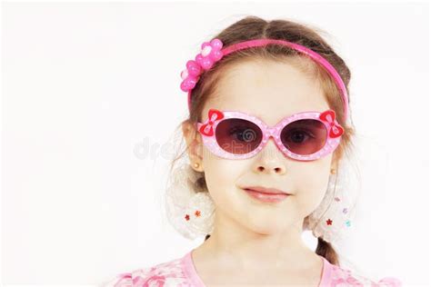 Portrait Of A Pretty Cute Young Girl Wearing Pink Sunglasses Stock