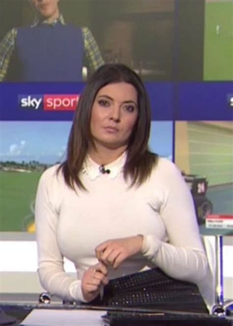 A Woman Sitting At A Desk In Front Of A Tv Screen With The Sky Sports