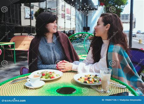 Mature Mother And Her Young Daughter Sit Together In Cafe Or Restaurant Women With Good