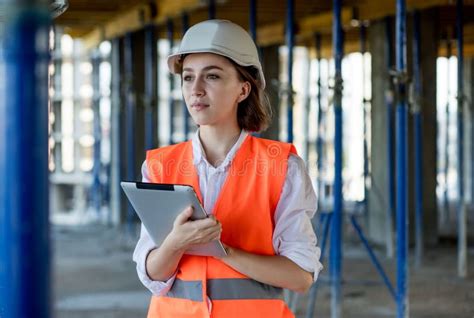 female construction engineer architect with a tablet computer at a