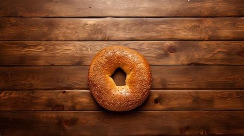 Premium Ai Image Delicious Bagel On Wooden Table A Mouthwatering Treat