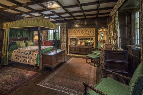 An Ornate Bedroom With Green And Gold Decor On The Walls Carpeted
