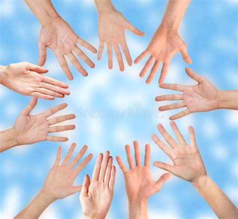 Group Of People Hands Together Looking Up View Over Sky Stock Photo