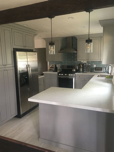 Light grey kitchen with white quartz worktops suffolk. Open kitchen concept with gray cabinets, white quartz ...