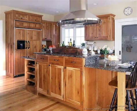 The warm tones of wooden cabinetry lend softness to the clean lines of the kitchen. Pictures of Kitchens - Traditional - Light Wood Kitchen ...