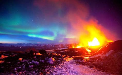 Volcano Spewing Lava With Aurora Borealis In The Background In Iceland