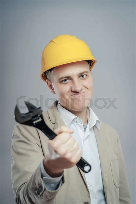 Young Builder With Adjustable Wrench In Hand Stock Image Colourbox