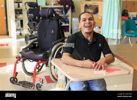 Boy With Spastic Quadriplegic Cerebral Palsy Learning At School Stock