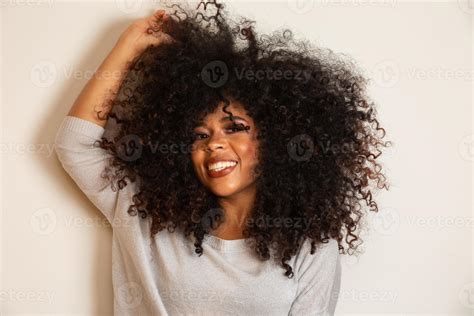 beauty portrait of african american woman with afro hairstyle and glamour makeup brazilian