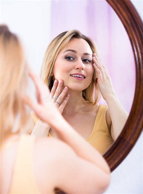 Young Woman Looking In The Mirror Stock Photo Image Of Caucasian