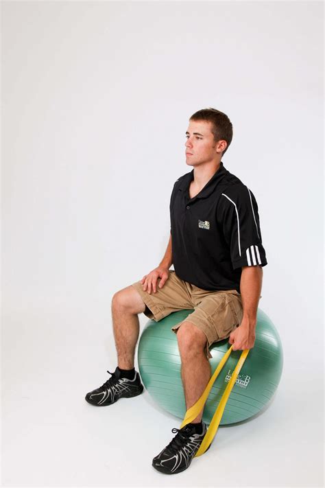 Seated Stability Ball Loop Front Raise 1 Arm Live 2 B Healthy Trainers