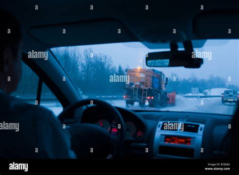 Winter Conditions On Road Snow Plow In Sight Stock Photo Alamy