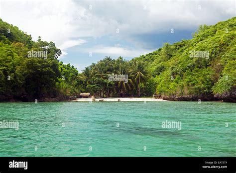 A Filipino Tourist Boat Approaches One Of Hundreds Of Remote Island
