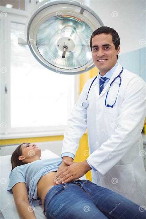 Doctor Examining The Stomach Of A Female Patient Stock Image Image Of