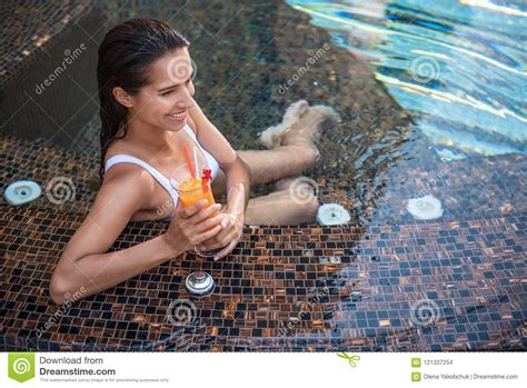Cheerful Girl Tasting Cocktail In Swimming Pool Stock Photo Image Of