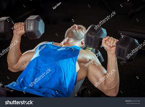 Young Adult Male Bodybuilder Doing Bicep Stock Photo 252241585