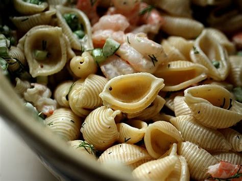 Pour the dressing over the pasta, sprinkle with the parmesan and parsley, and toss well. Ina Garten's Shrimp Salad: http://www.foodnetwork.com ...