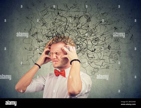 Stressed Young Man With A Mess And Confusion In His Head Stock Photo