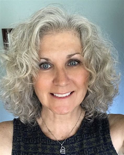 Not only does this style require very little maintenance, it also goes easily from casual to dressy. Nice, but this is my hair and I really dislike the look on me. | Grey curly hair, Medium hair ...