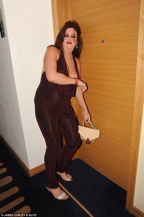 lisa appleton nearly spills out of her plunging jumpsuit daily mail online