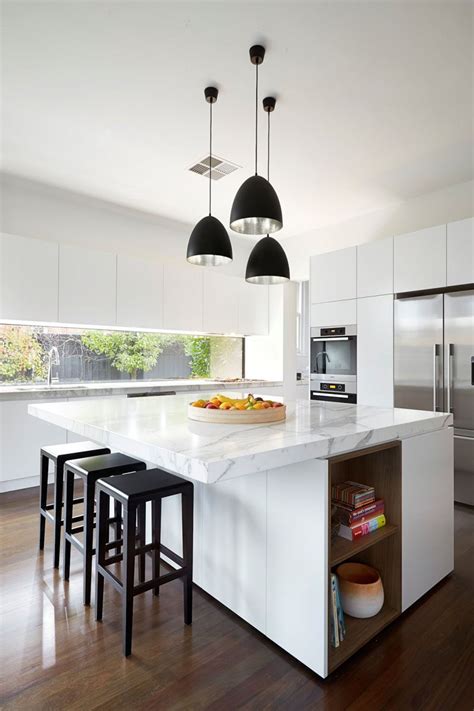 To go contemporary, pair your white cabinets with black hardware. Kitchen Design Idea - White, Modern and Minimalist ...