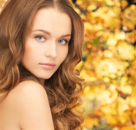 premium photo health and beauty concept face of beautiful woman with long hair over yellow