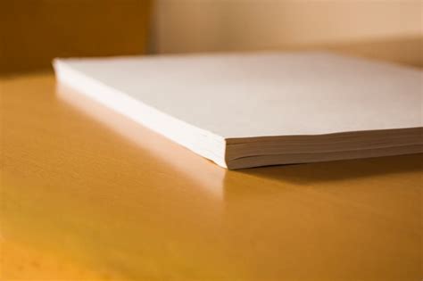 Free Photo Stack Of Papers On Table