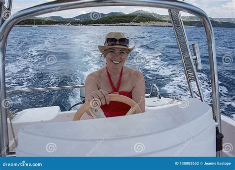 Women In Mid S Driving A Small Boat Stock Photo Image Of Powerboat Luxury